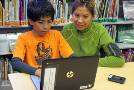 Mother and son on a laptop with a hotspot.